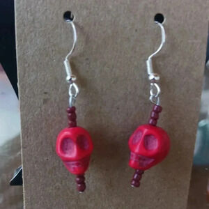 Set of really cool skulls earrings NWT...925 silver